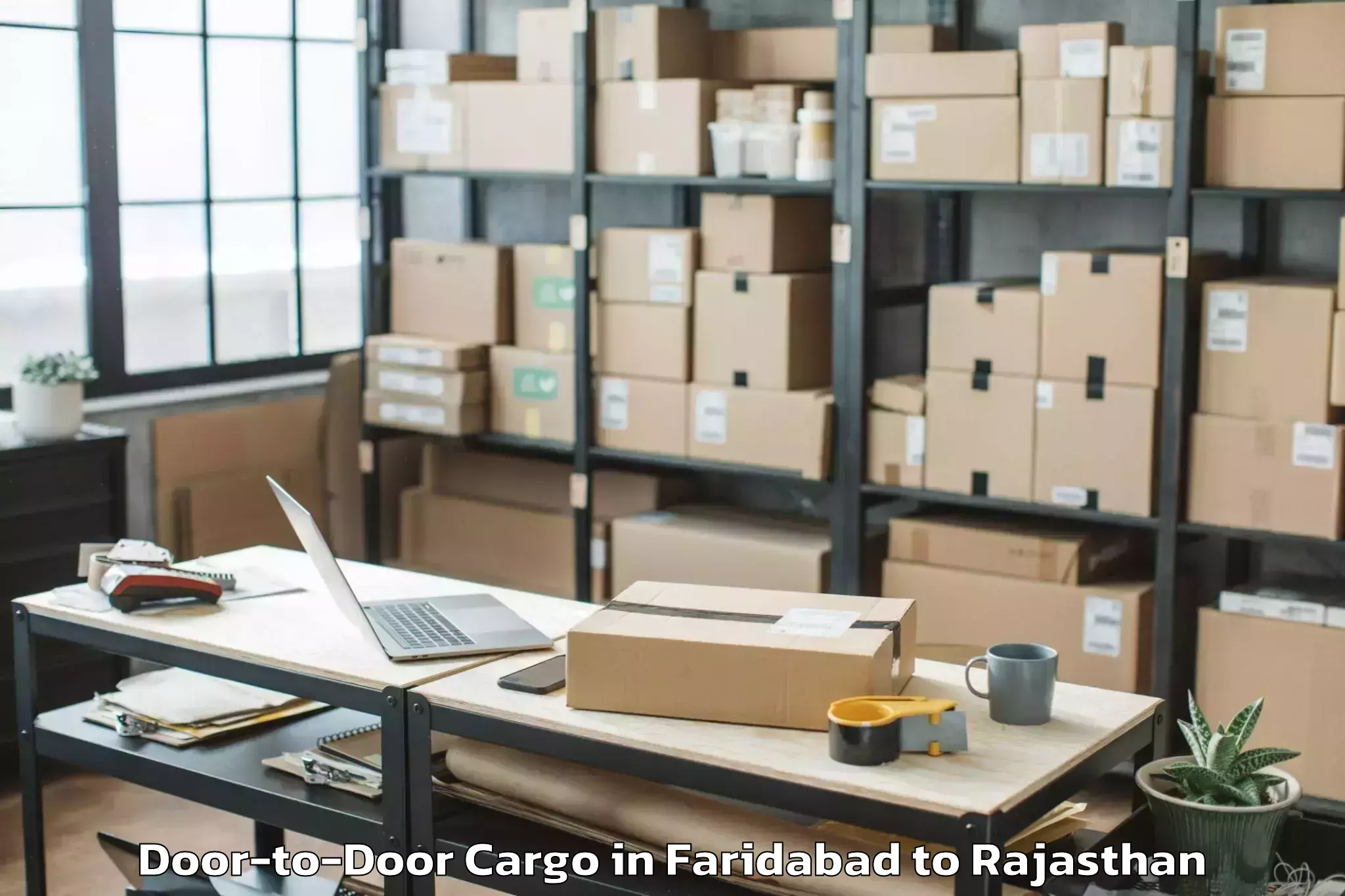 Professional Faridabad to Chittorgarh Door To Door Cargo